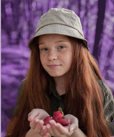 Girl with Strawberries wearing a bucket hat
